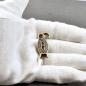 Preview: Alemannische Adlerfibel aus Bronze mit roter Glaseinlage auf Hand, jetzt kaufen von Belanas Schatzkiste